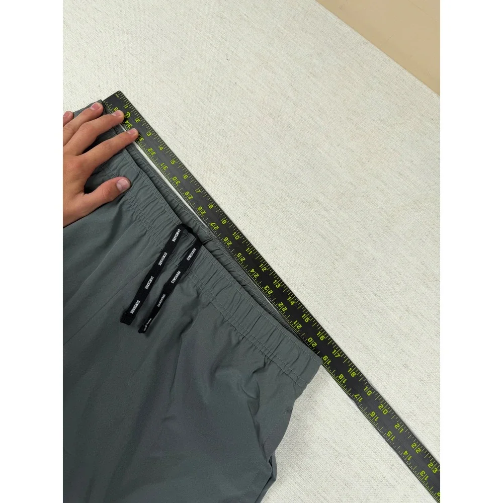 Gymshark Arrival Woven Joggers Mens Large Charcoal Grey Slim Tapered Zip Ankle